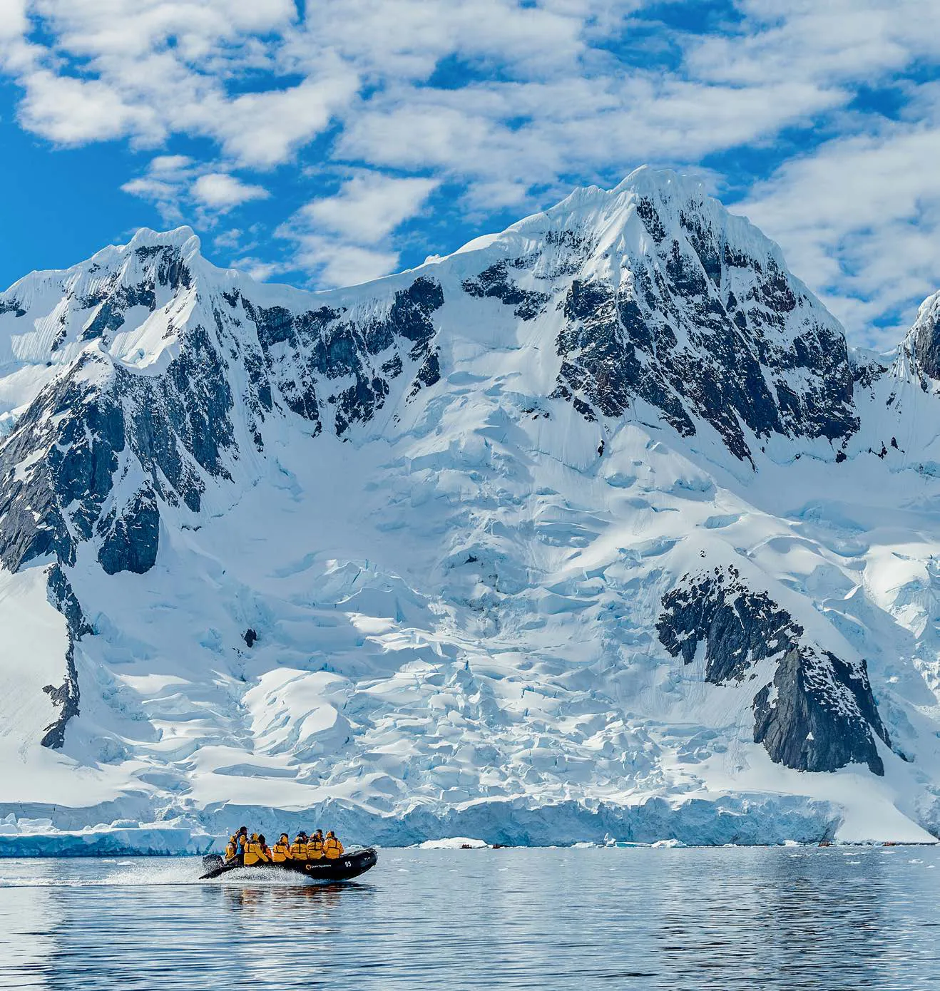 Zodiac beneath the glaciers of the Antarctic Peninsula